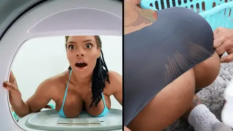 A big-titted ebony gets stuck in the washing machine